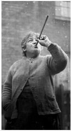 Mary Smith using peas as an alarm clock. Pea shooter through straw to hit window and wake people up.